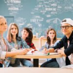group-students-posing-table